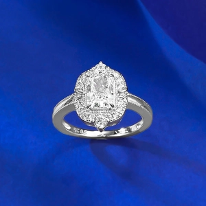 Macro detail of S925 sterling silver ring with rectangular ice cut diamond and halo