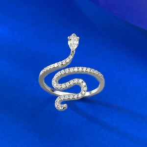 Elegant silver snake ring with sparkling zircons and a pear-cut stone on a blue background