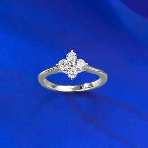 Macro detail of S925 sterling silver four-leaf clover ring with sparkling zircon petals