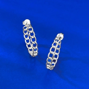 Macro shot of S925 sterling silver hollow curb chain earrings with hallmark detail