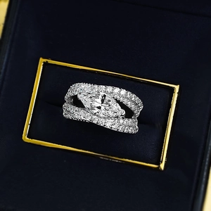Marquise cut diamond ring in 925 sterling silver set in a luxury navy blue jewelry box