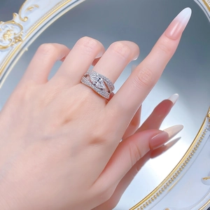 Detailed view of S925 silver ring featuring marquise-cut stone and hollow crisscross band