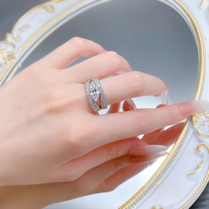 Detailed view of marquise-cut diamond silver ring with multi-row pavé setting on hand