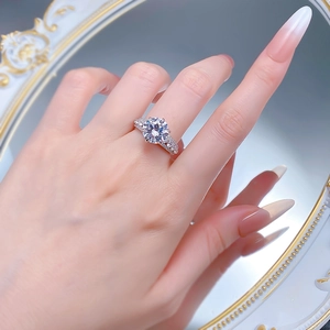 Luxurious S925 silver ring featuring 10mm round simulated diamond on a model's finger