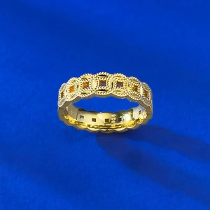 Detailed macro view of S925 sterling silver gold-plated ring with ancient coin motif