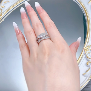 Close-up of S925 silver marquise cut diamond ring on hand with elegant vintage mirror