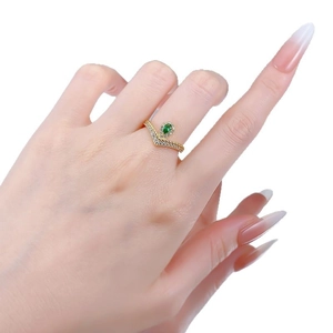 Pear-cut emerald v-shaped silver ring in gold finish with micro-paved zircons