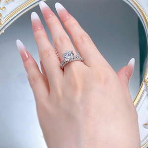 Macro detail of a 10mm round sparkling solitaire ring with a matching diamond band set