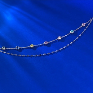 S925 sterling silver double-layer bracelet with colorful rainbow zircons on blue background