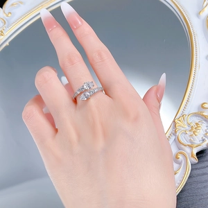 Detailed view of bypass snake ring in S925 silver with sparkling pear-shaped stones
