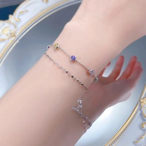 Close-up of double-layer S925 silver bracelet featuring colorful round gemstones on model