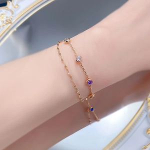 Close-up of double-layered S925 silver bracelet with rainbow gemstones on a wrist