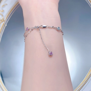 Detail of S925 sterling silver bracelet with pink and blue round cut zircon crystals