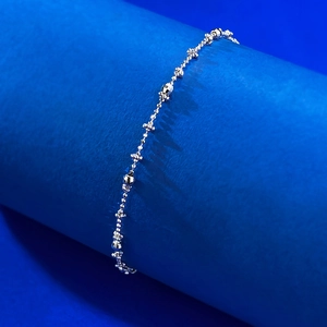 Detailed close-up of S925 silver star chain bracelet with a polished metallic finish