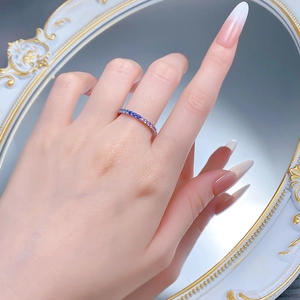 Detailed shot of S925 silver ring with gradient lavender and blue gemstones worn on hand