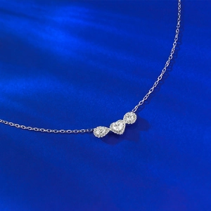 S925 sterling silver necklace featuring pear, heart, and round cut moissanite pendants