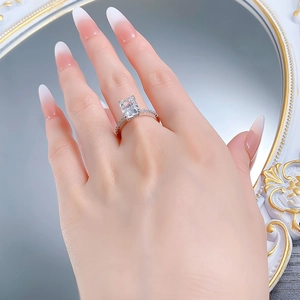 Detail of S925 silver ring with a rectangular radiant cut stone on a hand display