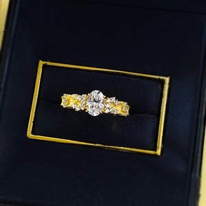 S925 silver gold plated oval gemstone ring with pavé diamonds in a blue jewelry box