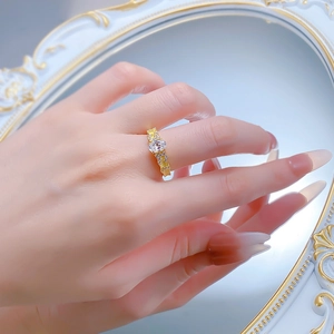 Macro detail of S925 silver oval cut crystal ring on finger with vintage gold finish