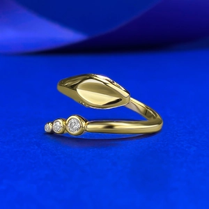 Luxurious S925 silver gold snake-shaped open ring with zircon stones on blue silk