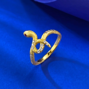 Snake wrap ring in frosted gold finish with sparkling white stones and red gemstone eyes