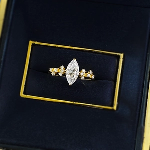 Elegant marquise cut simulated diamond ring in gold plating showcased in a blue velvet box