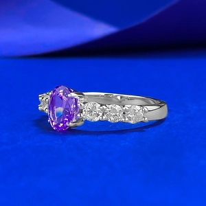 S925 silver ring featuring an oval purple gemstone and side sparkling crystals