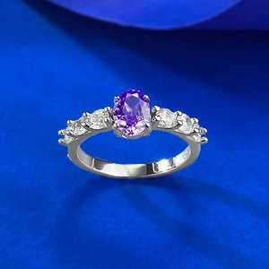 Macro shot of S925 sterling silver ring showing the inner material hallmark and purple gem