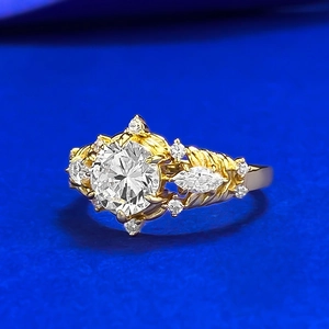 Elegant gold S925 silver ring featuring marquise simulated diamonds and a twist band design