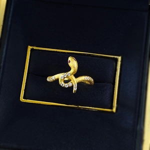 Elegant gold S925 sterling silver snake ring with white crystals and red gemstone eyes