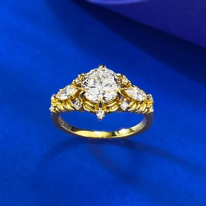 Macro detail showing 14K hallmark and marquise side diamonds on vintage gold ring