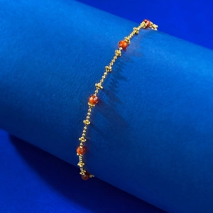 Close-up of S925 silver beaded chain featuring faceted red agate gemstones