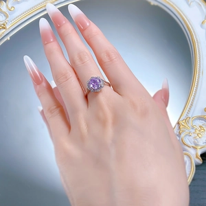 Detail shot of a S925 silver ring featuring a purple millennium rose cut diamond stone