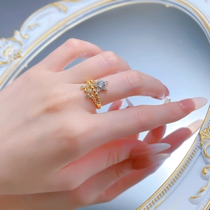 Detail of S925 silver shooting star ring with two-tone gold plating and zircon on a hand