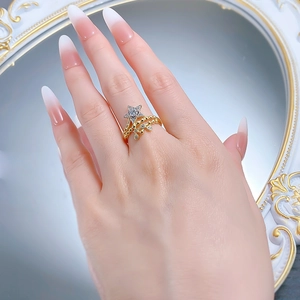 Detailed view of gold S925 silver star ring with micro-set zircons and beaded band charm