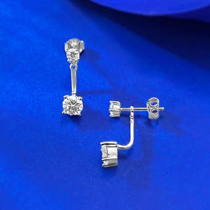 Macro detail of S925 sterling silver ear jackets with sparkling zircon stones