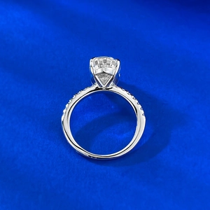 Detailed close-up of 4.5 carat ice cut silver ring with four-prong set round gemstone