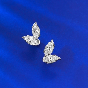 Sparkling 1.25ct marquise cut leaf earrings in silver set on premium blue silk background