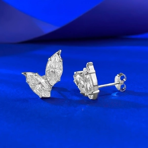 Close-up of 1.25ct marquise cut leaf diamond stud earrings in a white gold V-shape setting