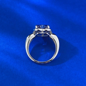 Macro shot of S925 silver ring featuring a blue heart gemstone with light reflection