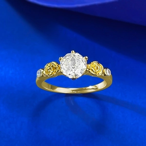 Macro detail of hexagonal cut diamond ring featuring rose gold floral side carvings