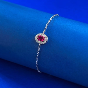 Elegant S925 silver bracelet with oval red gemstone and white halo zircon setting