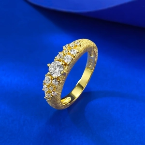 Macro shot of S925 sterling silver gold plated ring with brushed texture and S925 stamp