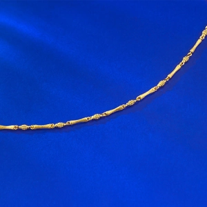 Macro shot of S925 sterling silver golden bamboo link chain with brushed matte finish
