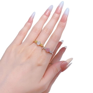 Elegant rose floral ring set with round white diamond and pink gemstone on hand