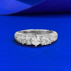 Brushed S925 sterling silver ring featuring a round clear center stone and accent gems
