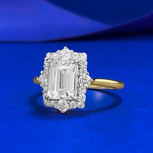 Elegant rectangular halo ring with 18K gold band and emerald-cut white diamond