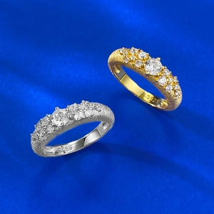 Gold and silver S925 brushed rings with sparkling central zircon and side stones