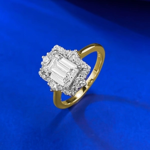 Macro detail of S925 emerald cut halo ring showing the golden band and hallmark
