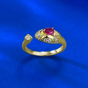 Detailed close-up showing the S925 hallmark on a gold snake ring with a heart ruby